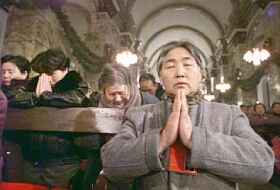People in a cathedral in Christmas in China